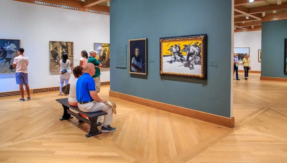 visitors pause in the N. C. Wyeth Gallery at the Brandywine Museum of Art.