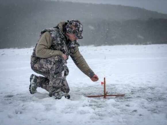 Ice Fishing on Frozen Lake in Pennsylvania.