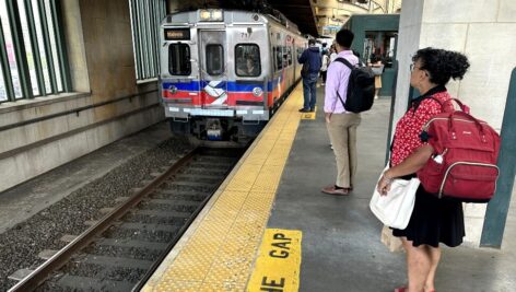 Passengers waiting to board an arriving SEPTA train at 30th Street Station.