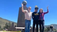 Carlos Wylde-Gladbach and his parents stand on the equator at the Mitad del Mundo complex in Ecuador.