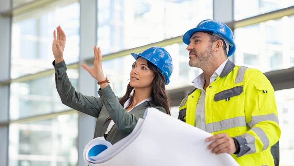 civil engineers in front of building project
