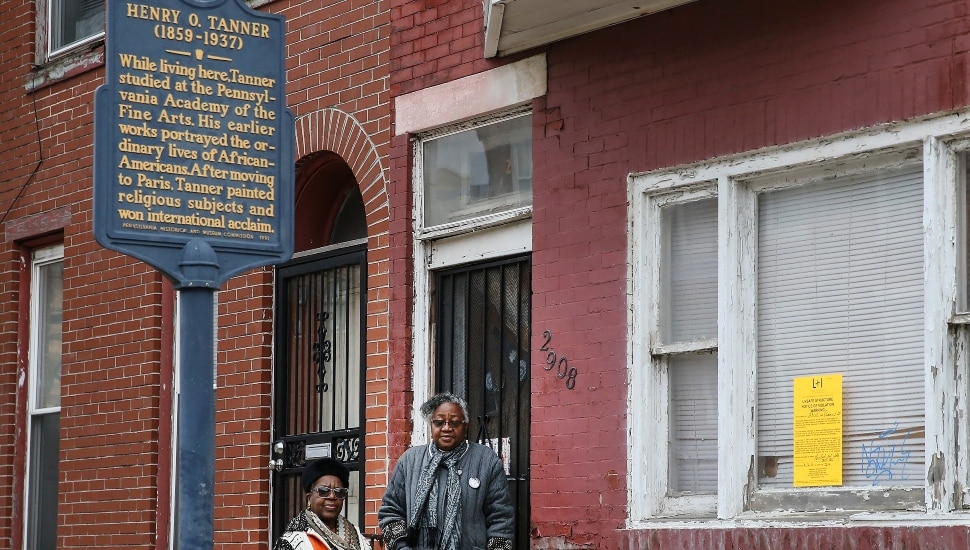 Two women stand in the doorway of the Henry Ossawa Tanner House in North Philadelphia.