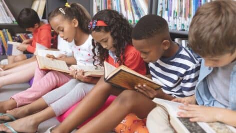 Kids reading in a library