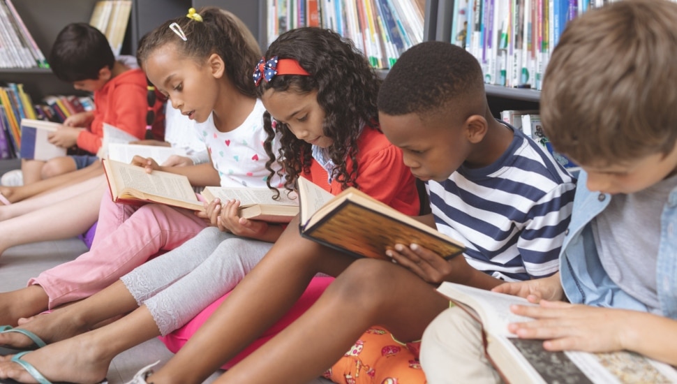 Kids reading in a library