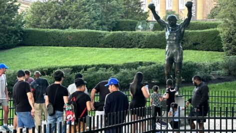 Tourist visit the Rocky Statue in front of the Philadelphia Museum of Art.