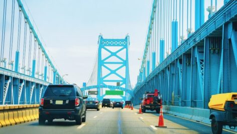 Cars driving over the Benjamin Franklin Bridge