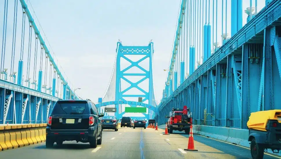 Cars driving over the Benjamin Franklin Bridge