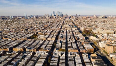 Areal view of row houses in South Philly and Philadelphia skyline.