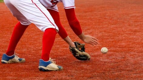 Infielder fielding a ground ball