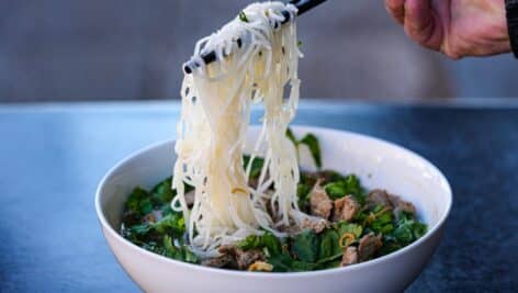 A noodle dish with meat and greens from Mawn.