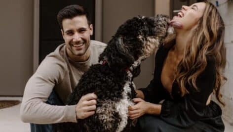 Boozy Mutt co-owners Sam and Allison Mattiola with their dog, Buda.