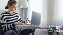 A student working on a laptop.