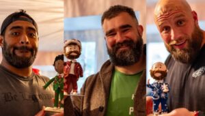 Philadelphia Eagles’ Jason Kelce, Jordan Mailata and Lane Johnson holding their look-alikes.