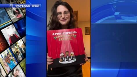 Hannah Westerman holds cover to "A Philly Special Christmas'