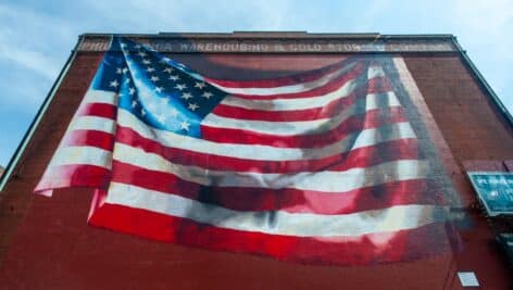 The building with the "Our Flag Unfurled" mural