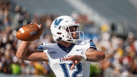 Tanner Maddocks throwing a football