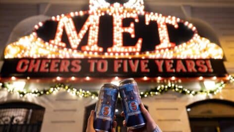 Five-Year Anniversary beer in front of The Met Philadelphia exterior