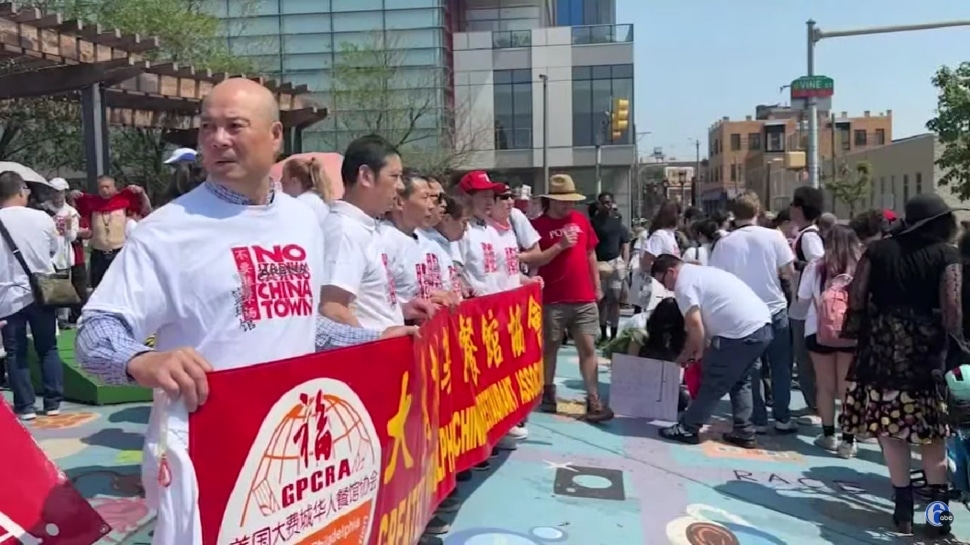 People protesting in Chinatown against proposed 76ers arena