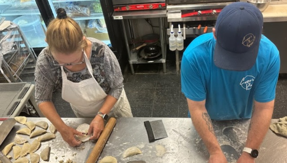 People making pierogis