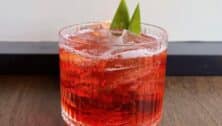 Drink made with pineapple mezcal, coconut Campari, and vermouth.