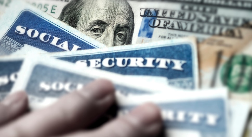 Social Security Cards with US One Hundred Dollar Bill