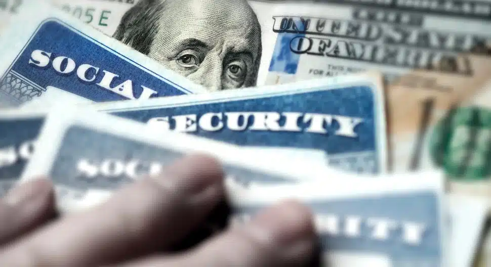 Social Security Cards with US One Hundred Dollar Bill