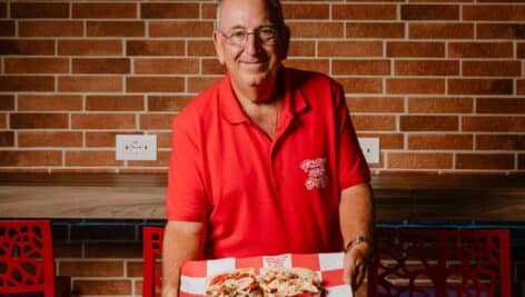 Michael Paparella holding a cheesesteak.