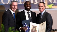 Photo of Bernard Tynes receiving award.