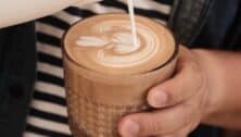 Creamer being pour into a coffee