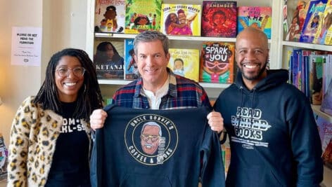 Evisa Gallman, Bob Kelly, Justin Moore inside Uncle Bobbie's Coffee and Books.