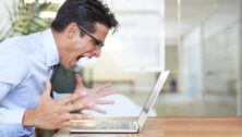 Man yelling at his laptop.