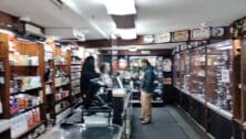 Customers and employees inside Northeast Philly headshop, Artifax, during one of its final days in businesses.