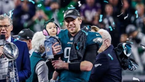 Nick Foles holds daughter as confetti falls after winning the 2018 Super Bowl.