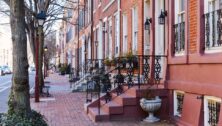 Rows of brownstone apartment buildings in Center City with windows, stoops and planters