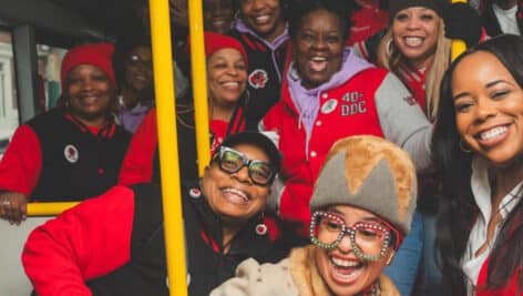 Women inside a bus for the The Sisterhood Sit-In Trolley Tour