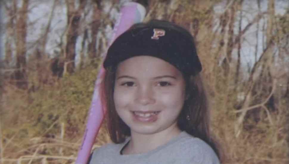 girl in baseball gear