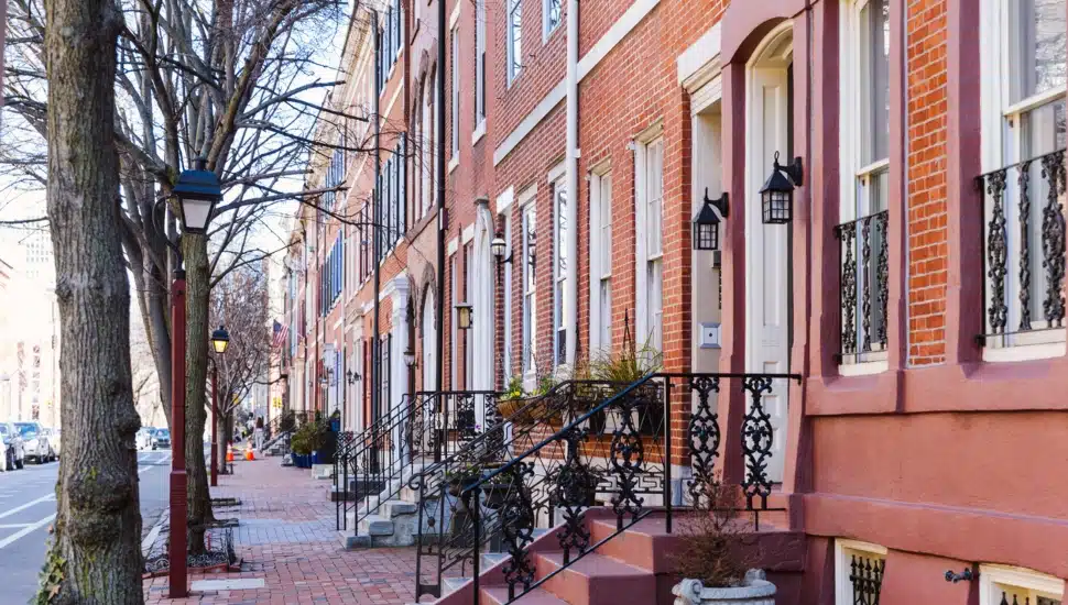 Rows of brownstone apartment buildings in Center City with windows, stoops and planters in Pennsylvania