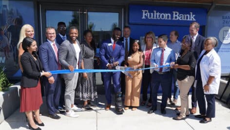 Fulton Bank representatives cut a ribbon