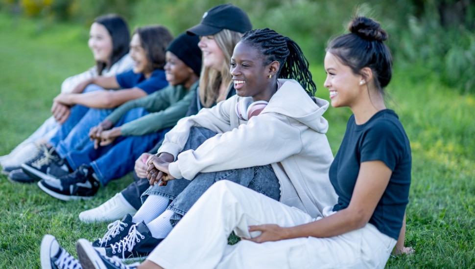 Youth sitting on the grass