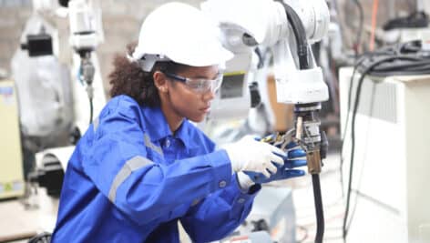 Engineer teaching robot welding machine