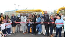 Elected officials, city representatives, and community members cut the ribbon at Ziehler Playground in Olney.