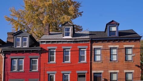 Old brick row houses with dormer windows