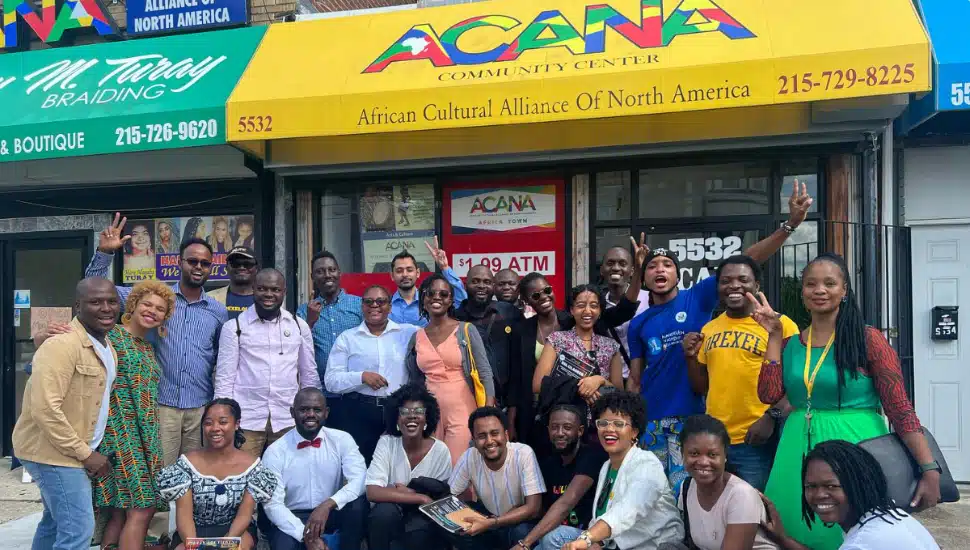 ACANA workers in front of its current headquarters.