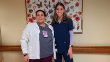 A nursing student senior from GMercyU stands with her nursing mentor from the Dedicated Education Unit program.