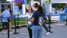 Widener student Indwija Bhatta talks to a Philadelphia Union fan outside of Subaru Park.