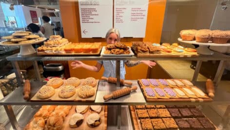 Meagan Benz with desserts and goods from Crust Vegan Bakery.