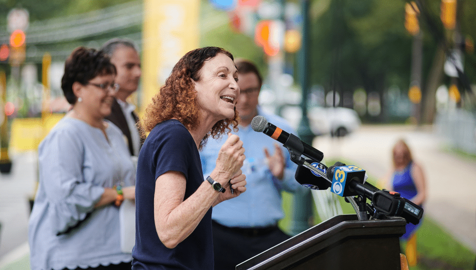 Jane Golden at a podium speaking at an event.