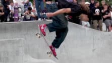 A young man skateboarding.