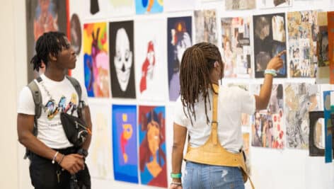 Students looking at artwork.