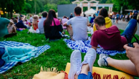 People watching an outdoor movie.